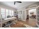 Spacious home office with hardwood floors and view into the dining room at 11911 Mandevilla Ct, Tampa, FL 33626
