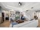 Bright living room featuring built-in shelving and hardwood floors at 11911 Mandevilla Ct, Tampa, FL 33626