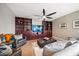 Cozy living room with built-in entertainment center and hardwood floors at 11911 Mandevilla Ct, Tampa, FL 33626