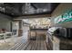 Outdoor kitchen features a grill, stone counters, and stainless steel appliances at 11911 Mandevilla Ct, Tampa, FL 33626