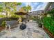 Spacious patio with seating and fire pit at 11911 Mandevilla Ct, Tampa, FL 33626