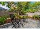 Small patio with bistro table and chairs at 11911 Mandevilla Ct, Tampa, FL 33626