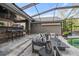 Relaxing pool area with covered seating and a pool at 11911 Mandevilla Ct, Tampa, FL 33626