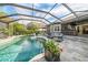 Inviting screened-in pool area with a large patio and outdoor seating at 11911 Mandevilla Ct, Tampa, FL 33626