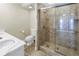 Bathroom with walk-in shower and marble countertop at 1350 Gulf Blvd # 703 704, Clearwater, FL 33767