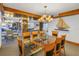 Elegant dining room with a glass table and chandelier at 1350 Gulf Blvd, Clearwater, FL 33767