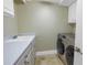 Laundry room with washer, dryer, and countertop at 1350 Gulf Blvd, Clearwater, FL 33767