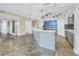 Modern wet bar with tile backsplash and cabinets at 1350 Gulf Blvd, Clearwater, FL 33767