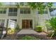 Private backyard with lush landscaping and a grill at 14215 Waterville Cir, Tampa, FL 33626