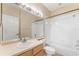 Clean bathroom with a bathtub, shower, and updated vanity at 14215 Waterville Cir, Tampa, FL 33626