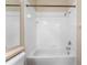 Simple bathroom with a shower/tub combo and white tile at 14215 Waterville Cir, Tampa, FL 33626