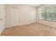 Spacious bedroom with double closets and neutral carpeting at 14215 Waterville Cir, Tampa, FL 33626