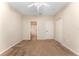 Bright bedroom with ensuite bathroom access and ceiling fan at 14215 Waterville Cir, Tampa, FL 33626