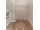 Walk-in closet with wire shelving and carpeted floor at 14215 Waterville Cir, Tampa, FL 33626