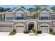Two story townhome with attached garage and neutral color scheme at 14215 Waterville Cir, Tampa, FL 33626
