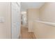 Upper hallway with carpet, doors, and archway at 14215 Waterville Cir, Tampa, FL 33626