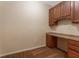Small home office with built-in desk and cabinets at 14215 Waterville Cir, Tampa, FL 33626