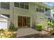 Private patio with adjacent green space and fence at 14215 Waterville Cir, Tampa, FL 33626