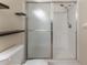 Shower stall with glass door and tiled walls at 14215 Waterville Cir, Tampa, FL 33626