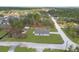 Aerial view of a house on a lot with trees at 14467 Hawk Rd, Brooksville, FL 34614