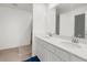 Bright bathroom with double vanity and large mirror at 14467 Hawk Rd, Brooksville, FL 34614