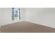 Bright bedroom with carpet and window at 14467 Hawk Rd, Brooksville, FL 34614