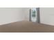Simple bedroom with carpet flooring and a window at 14467 Hawk Rd, Brooksville, FL 34614
