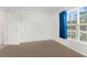 Bedroom with window and blue curtains at 14467 Hawk Rd, Brooksville, FL 34614
