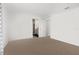 Spacious bedroom with carpet and access to bathroom at 14467 Hawk Rd, Brooksville, FL 34614