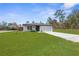 Single story home with one-car garage and front yard at 14467 Hawk Rd, Brooksville, FL 34614
