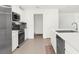 Modern kitchen with stainless steel appliances and breakfast bar at 14467 Hawk Rd, Brooksville, FL 34614