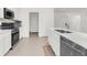 Modern kitchen with stainless steel appliances and white cabinetry at 14467 Hawk Rd, Brooksville, FL 34614