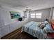 Comfortable bedroom with built-in storage and ocean-themed decor at 18650 Gulf Blvd # 413, Indian Shores, FL 33785