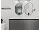 Modern bathroom with double vanity, walk-in shower, and stylish mirrors at 1905 W Erna Dr, Tampa, FL 33603