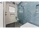 Spa-like bathroom with herringbone tile and a frameless glass shower at 1905 W Erna Dr, Tampa, FL 33603