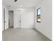 Simple bedroom with two doors and one window at 1905 W Erna Dr, Tampa, FL 33603