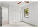 Spacious bedroom with double door closet and window at 1905 W Erna Dr, Tampa, FL 33603