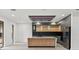 Modern kitchen with stainless steel appliances and an island at 1905 W Erna Dr, Tampa, FL 33603