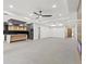 Open living room with high ceilings and ceiling fan at 1905 W Erna Dr, Tampa, FL 33603