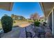 Cozy backyard patio with table and chairs, ideal for outdoor dining at 1972 Wolf Laurel Dr, Sun City Center, FL 33573