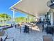 Community patio with tables, chairs, and lake views at 2509 Lynx Rd # 0, Sun City Center, FL 33573