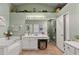 Elegant bathroom with a soaking tub, double vanity, and a walk-in shower at 25237 Lexington Oaks Blvd, Wesley Chapel, FL 33544