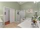 Bathroom with a soaking tub, shower, and double vanity at 25237 Lexington Oaks Blvd, Wesley Chapel, FL 33544