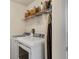Laundry room with washer, dryer, and additional shelving at 25237 Lexington Oaks Blvd, Wesley Chapel, FL 33544