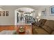 Open living room with view of kitchen and casual dining area at 25237 Lexington Oaks Blvd, Wesley Chapel, FL 33544