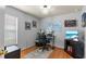 Home office with wood flooring, large desk, and plenty of storage at 25237 Lexington Oaks Blvd, Wesley Chapel, FL 33544