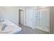 Main bathroom with double vanity and shower at 2883 Gardiner Ln, Zephyrhills, FL 33541