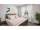 Bedroom with a queen bed and neutral decor at 2883 Gardiner Ln, Zephyrhills, FL 33541