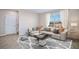 Spacious living room with light flooring and a large window at 2883 Gardiner Ln, Zephyrhills, FL 33541