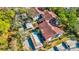 Aerial view of condos with parking and lush landscaping at 300 S Florida Ave # 400D, Tarpon Springs, FL 34689